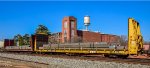 Bulkheads loaded with steel beams passing by Arcadia Heights